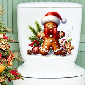Autocollant festif bonhomme pain d'épice sur un réservoir de toilette en céramique