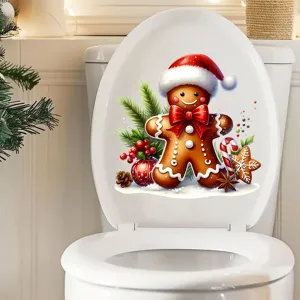 Gros plan d'un autocollant de Noël bonhomme de pain d'épices sur un abattant WC.
