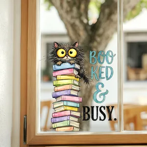 Decorative funny cartoon cat on a stack of books window decal with Booked & Busy text