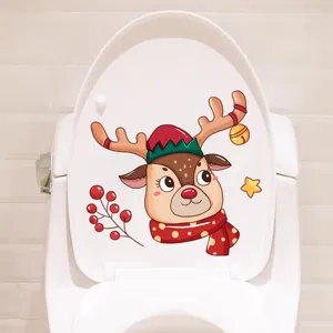 Cute cartoon reindeer Christmas sticker applied on a white toilet lid cover detail view