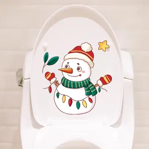 Festive Christmas snowman toilet lid sticker on a white ceramic bathroom background
