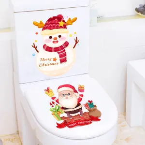Close-up of waterproof Christmas toilet stickers featuring Santa and Snowman designs