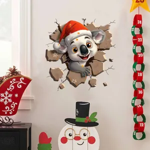 Detailed view of 3D Christmas koala wall sticker bursting through a cracked wall