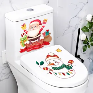 Detailed close-up view of Christmas Santa and snowman stickers on a white toilet lid