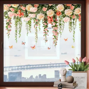 Floral and butterfly window stickers applied to a bright city-view glass window pane