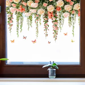 Detail of floral window decal with hanging roses and butterflies on glass.