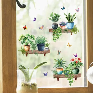 Detailed view of green potted plant and colorful butterfly static cling window stickers