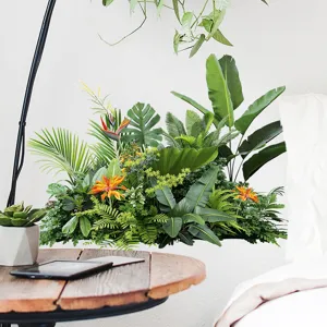 Detailed view of a tropical green plant wall sticker with lush leaves and orange flowers