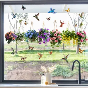 Vivid hummingbird and hanging flower basket static window decals on kitchen glass pane.