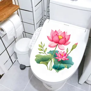 Close-up of a pink lotus flower waterproof sticker applied to a white toilet seat