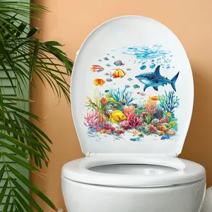 Vibrant undersea world decal with shark and coral reef on a white toilet seat cover