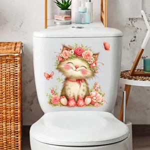 Detail of waterproof cat and butterfly sticker applied on a white toilet tank