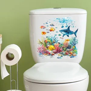 Detail of ocean shark and coral reef waterproof decal applied on a white toilet tank.
