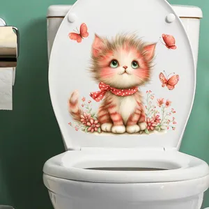 Close-up of a cute cat and butterfly waterproof sticker applied on a white toilet lid