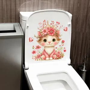 Detailed view of a cute cartoon cat sticker with flowers applied on a white toilet lid cover