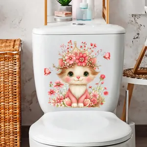 Detail view of an adorable cat with pink flower wreath sticker on a white toilet tank.