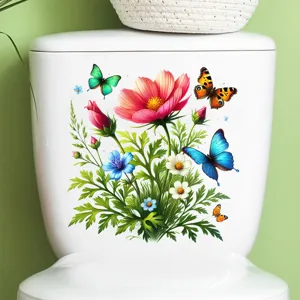 Detail view of colorful flower and butterfly waterproof stickers on a white toilet tank.