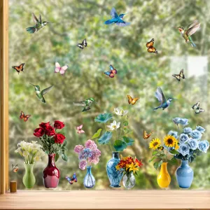 Detailed view of colorful hummingbird, butterfly, and floral vase static window stickers.