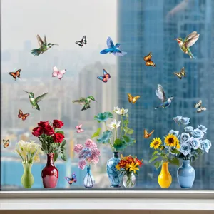 Colorful floral and hummingbird window static clings displayed on a clear glass surface