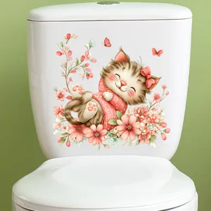 Macro view of cute cartoon cat and flower waterproof decorative sticker on a white toilet tank