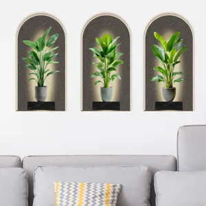 Minimalist set of three 3D tropical green plant wall stickers in arched frames over sofa