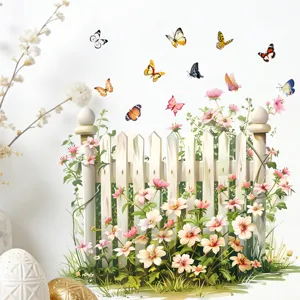 Detail van kleurrijke vlinder- en bloemmuurstickers met wit hekwerk voor wanddecoratie huis