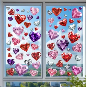 Colorful diamond heart static window clings decorated on a clear glass pane with sky view.