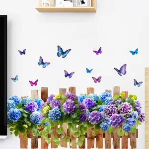 Detail showing vibrant hydrangea flowers and butterfly wall decals on a fence base.