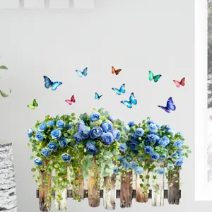 Detail view of blue rose and butterfly fence wall sticker on a clean white background