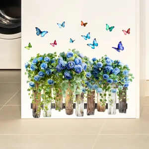 Detailed view of 3D wall sticker with blue roses, wooden fence and butterflies.