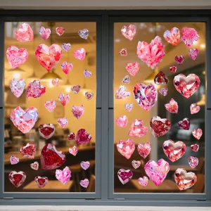 Beautiful crystal diamond heart-shaped static cling window stickers on a glass storefront.
