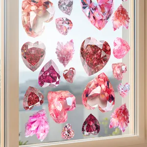 Detail view of pink crystal heart diamond static cling window stickers on glass