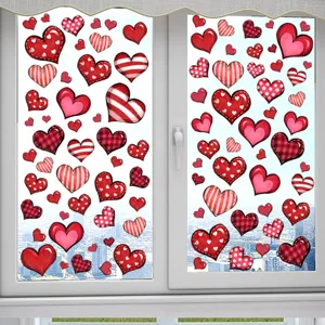 Detail of red heart patterned static cling window stickers for romantic Valentine decor.
