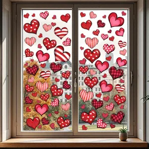 Collection of patterned red heart static window stickers applied on a glass window