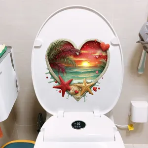 Heart-shaped tropical beach sunset waterproof sticker applied to a white toilet lid