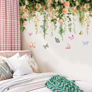 Detail of floral rose vine and butterfly wall stickers in a cozy bedroom setting