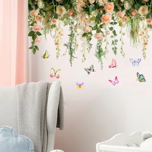 Detailed view of rose flower vine and colorful butterfly wall stickers in a room setting.