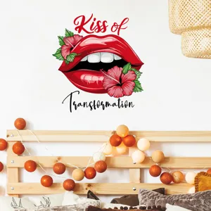 Detailed view of red lips and floral wall sticker with Kiss of Transformation text
