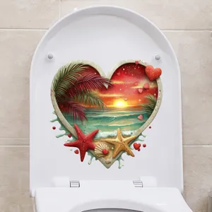 Detailed view of 3D heart-shaped tropical beach sunset sticker on a white toilet lid