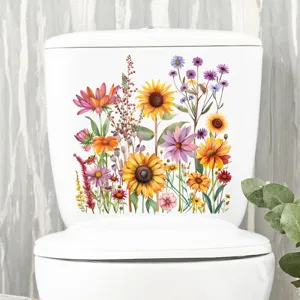 Detailweergave van kleurrijke zonnebloem en bloemensticker op wit toiletreservoir
