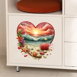 Detail view of heart-shaped beach sunset wall decal applied to a white cabinet door