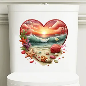 Detail view of heart shaped beach sunset sticker on a white bathroom toilet tank