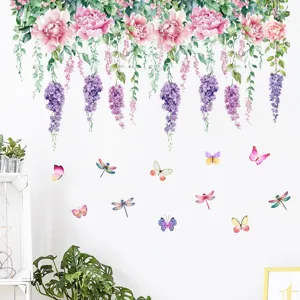 Watercolor floral vine wall stickers with butterflies and dragonflies on a white wall