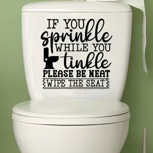 Detailed view of a humorous waterproof bathroom sticker on a white toilet cistern.