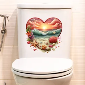 Heart-shaped beach sunset waterproof self-adhesive sticker applied on a white toilet tank.