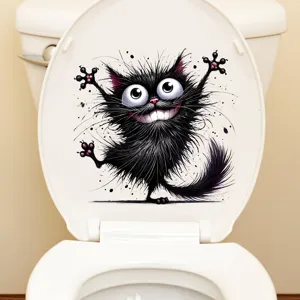 Detailansicht eines lustigen schwarzen Katzenaufklebers auf einem weißen Toilettendeckel