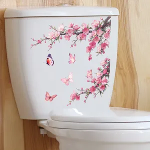 Detailed view of pink blossom and butterfly waterproof self-adhesive sticker on white toilet