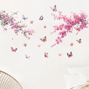 Detailed view of pink cherry blossom and butterfly wall stickers in a bedroom