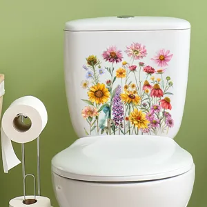 Gedetailleerde weergave van waterdichte zonnebloemstickers op een wit toiletreservoir