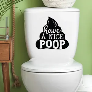 Close-up detail of the funny 'Have a Nice Poop' waterproof vinyl decal applied on a toilet
